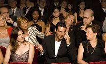 Hispanic_man_talking_on_cell_phone_in_theatre_bld071608_thumb